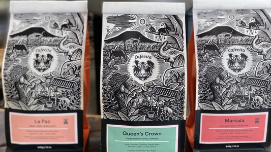 Three bags of Cafecita Coffee options: La Paz, Queen's Crown, and Marcala